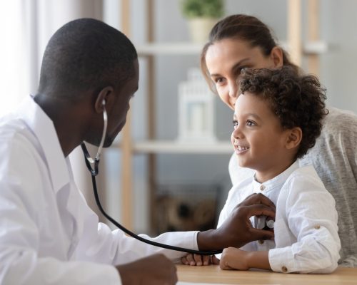 African,American,Male,Pediatrician,With,Stethoscope,Listening,To,Lung,And